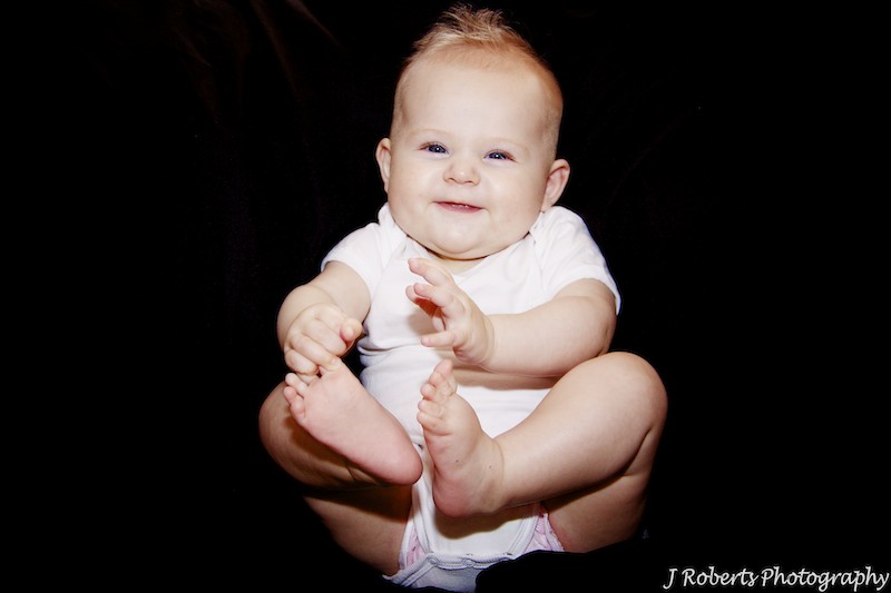 6 month old little girl with black backdrop - baby portrait photography sydney